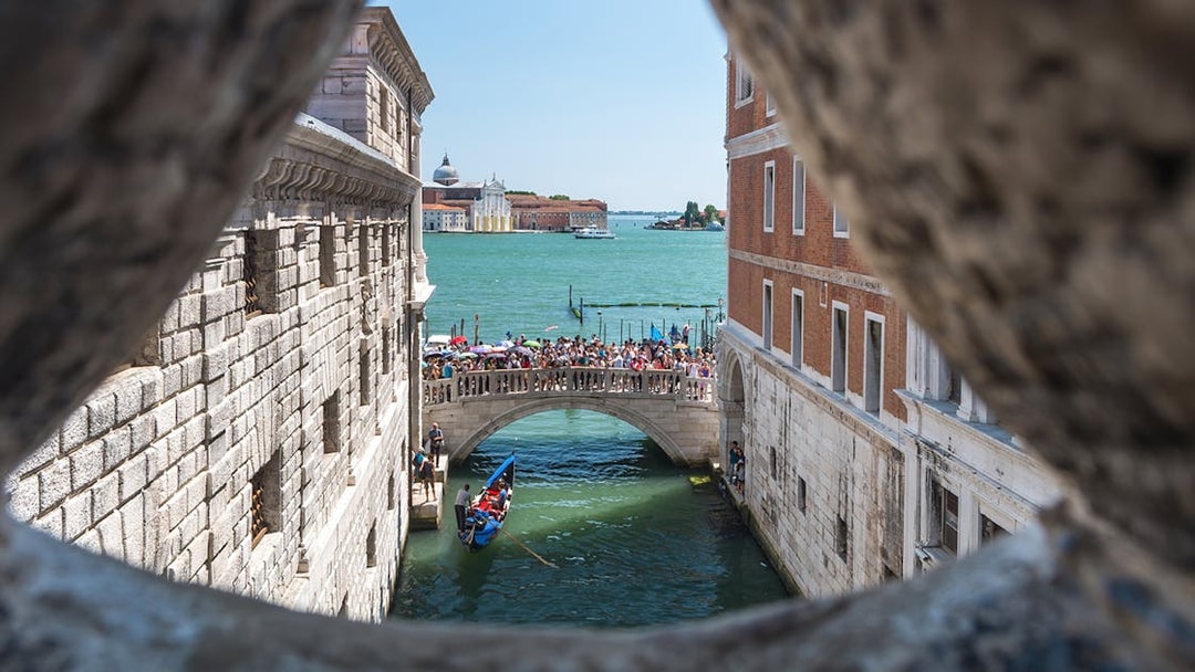 View of Venice canal and bridge from the Bridge of Sighs.
