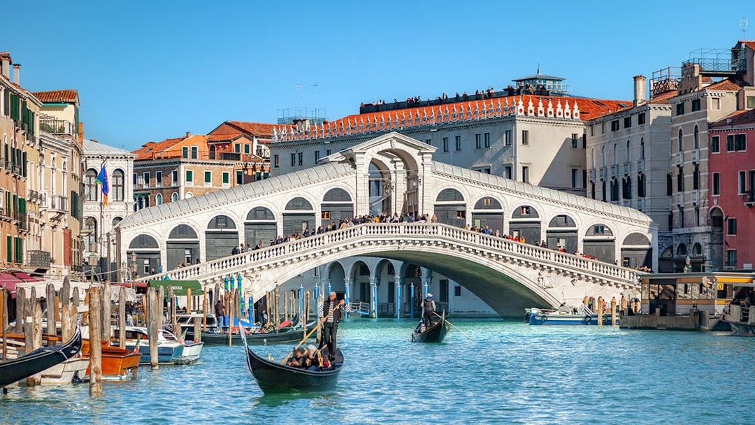 Gondolas on the Grand Canal near Rialto Bridge, Venice.