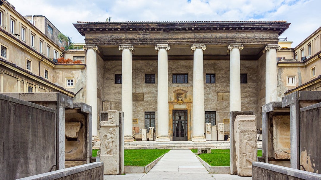 Verona archaeological museum entrance with ancient columns and stone carvings.
