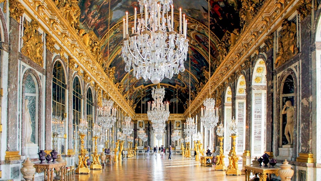 Hall of Mirrors, Versailles Palace, ornate chandeliers, gilded decor, arched mirrors, France.