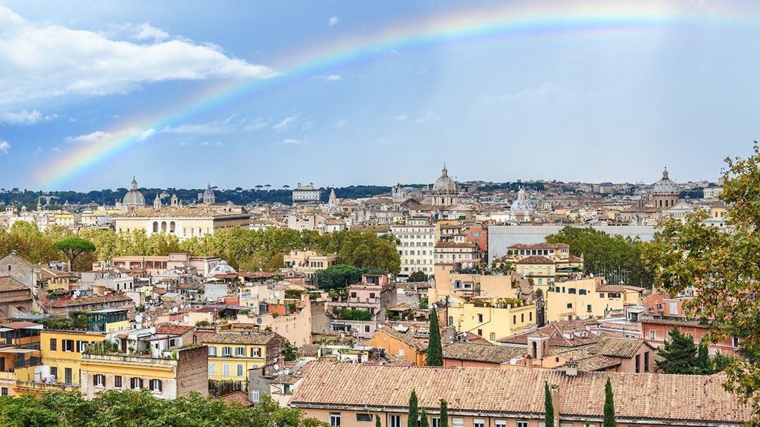 Arial view of Rome with a rainbow from Janiculum Hill, Italy.