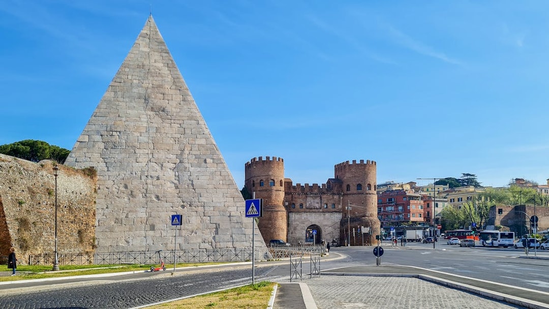 Pyramid of Cestius and Porta San Paolo in Rome, Italy.