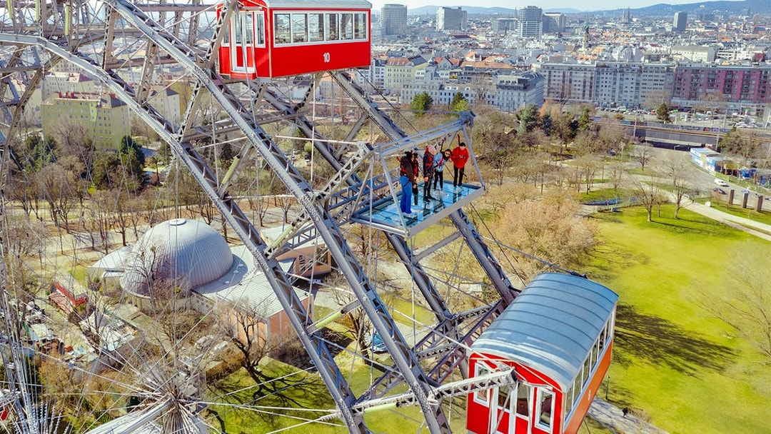 Passengers viewing Vienna cityscape from the Giant Ferris Wheel.