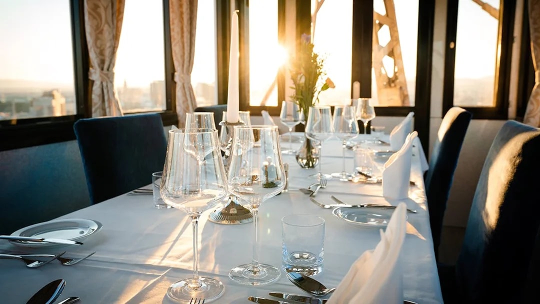 Dinner table set at sunset inside cabin on Vienna Giant Ferris Wheel.