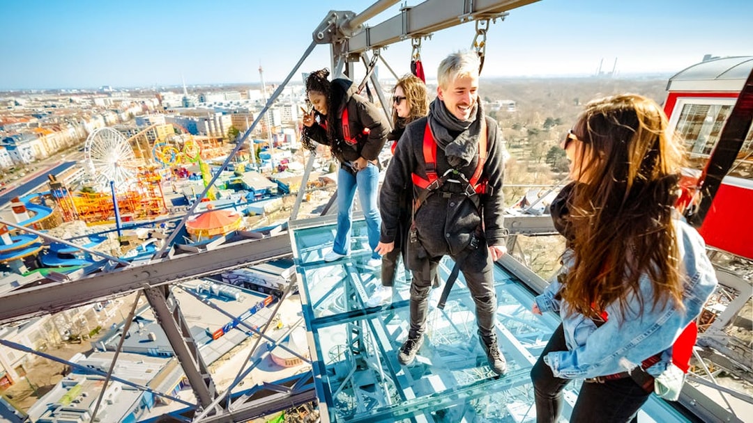 Passengers enjoying city view from Vienna Giant Ferris Wheel.