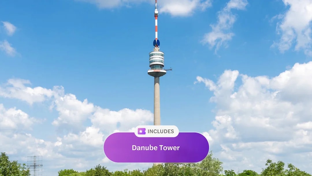 Danube Tower in Vienna against a blue sky.