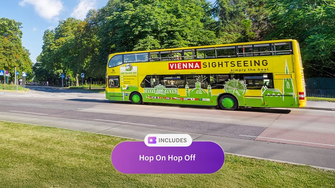 Vienna sightseeing bus on city street, part of Vienna Flexi Pass tour.