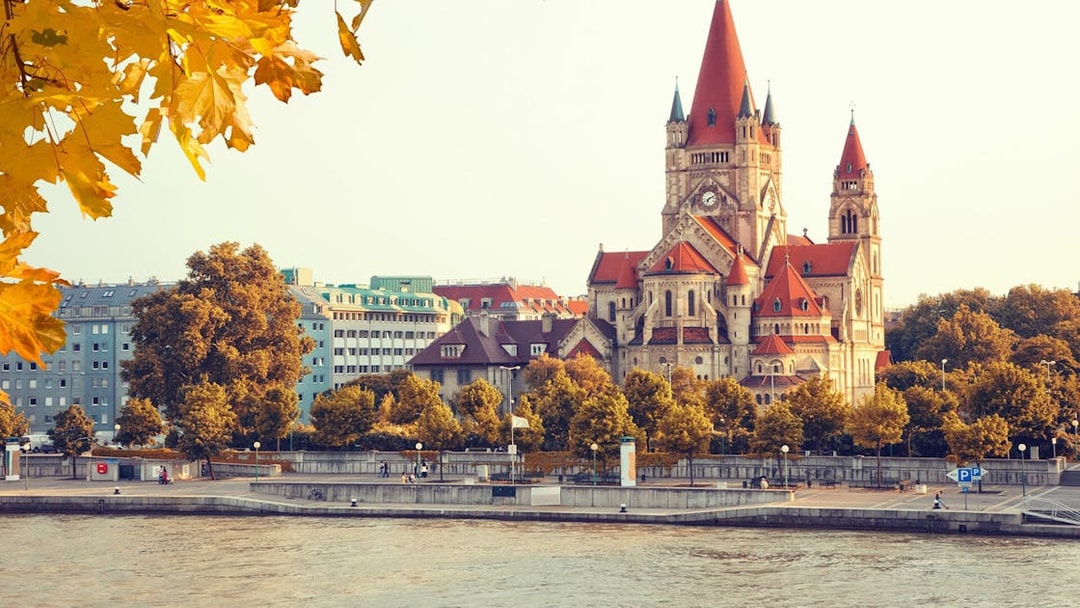 St. Francis of Assisi Church by the Danube River in Vienna during autumn.