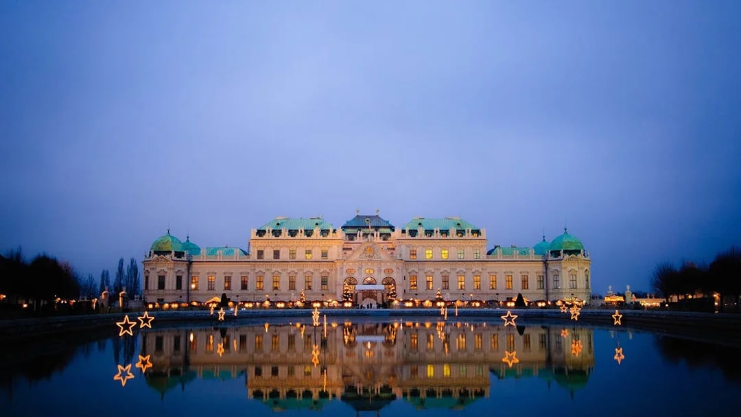 Belvedere Palace illuminated at night with reflection in Vienna, Austria.