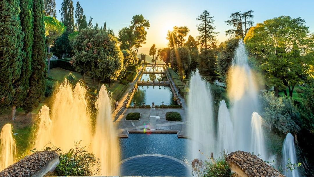 Villa d'Este fountains and pond at sunset in Tivoli, Italy.