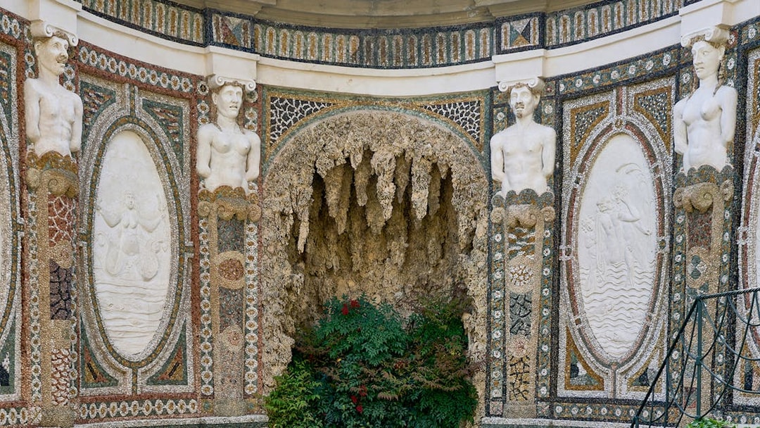 Villa d’Este ornate wall with statues and intricate mosaics, Tivoli, Italy.