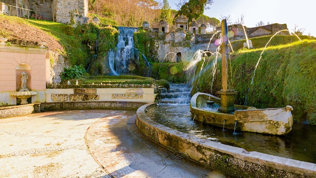 Villa D'Este fountains and gardens in Tivoli, Italy, featuring cascading waterfalls and ornate sculptures.