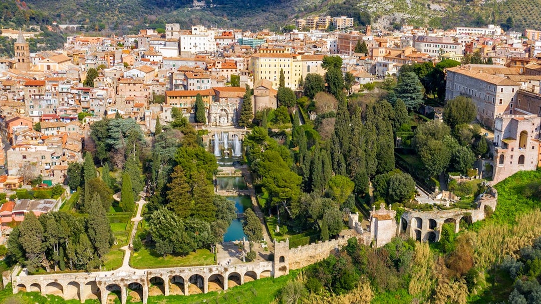Tourists exploring Villa d'Este gardens in Tivoli, Italy with skip-the-line tickets.