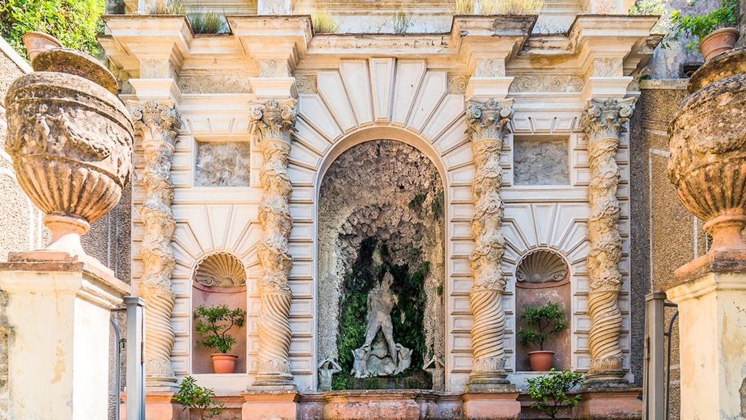 Villa d’Este ornate fountain with intricate columns and statues in Tivoli, Italy.