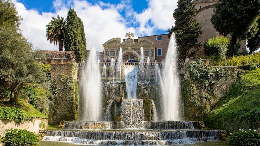 Fountains and gardens at Villa d'Este in Tivoli, Italy, with cascading water and lush greenery.