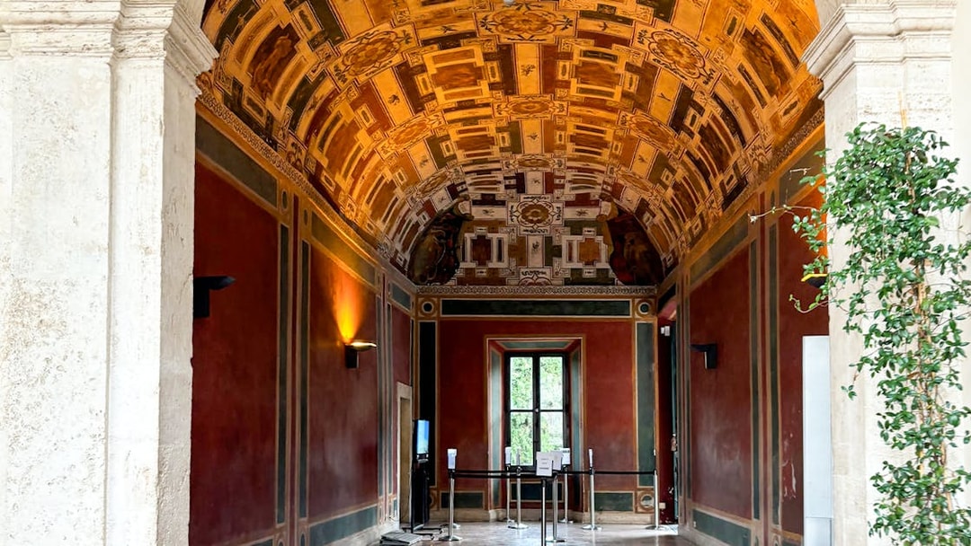 Frescoed room interior at Villa d'Este, Tivoli, Italy, showcasing intricate ceiling designs.