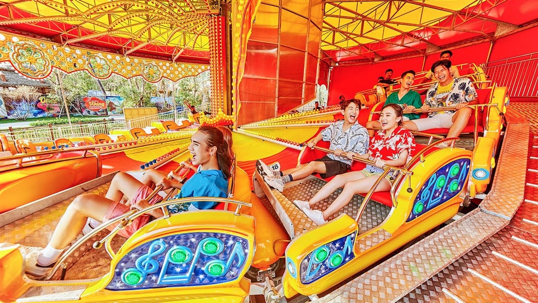 Visitors enjoying a colorful ride at VinWonders Phu Quoc.