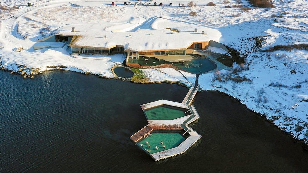 Vök Baths geothermal pools in snowy landscape, Egilsstaðir, Iceland.