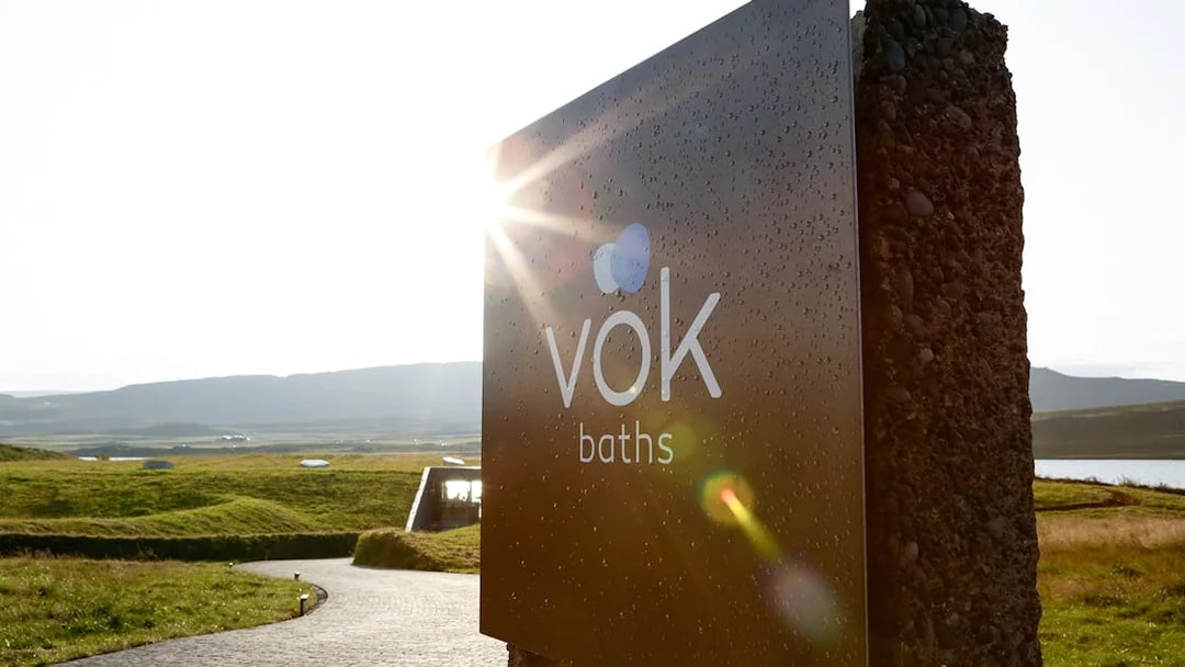 Vök Baths entrance sign with scenic view in Egilsstaðir, Iceland.