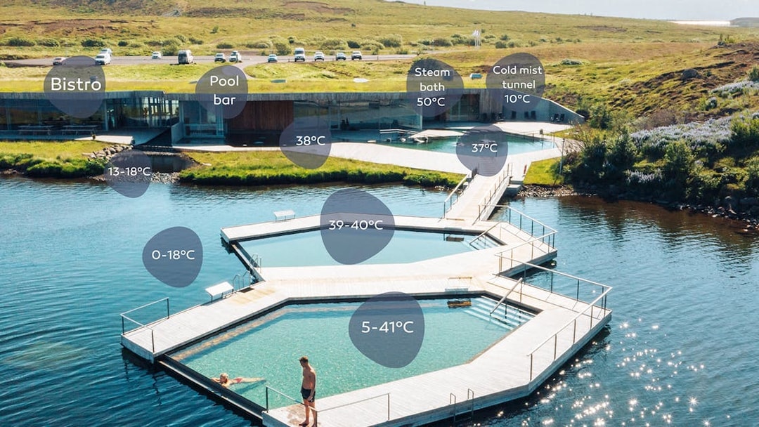 Vök Baths geothermal pools with temperature markers in Egilsstaðir, Iceland.