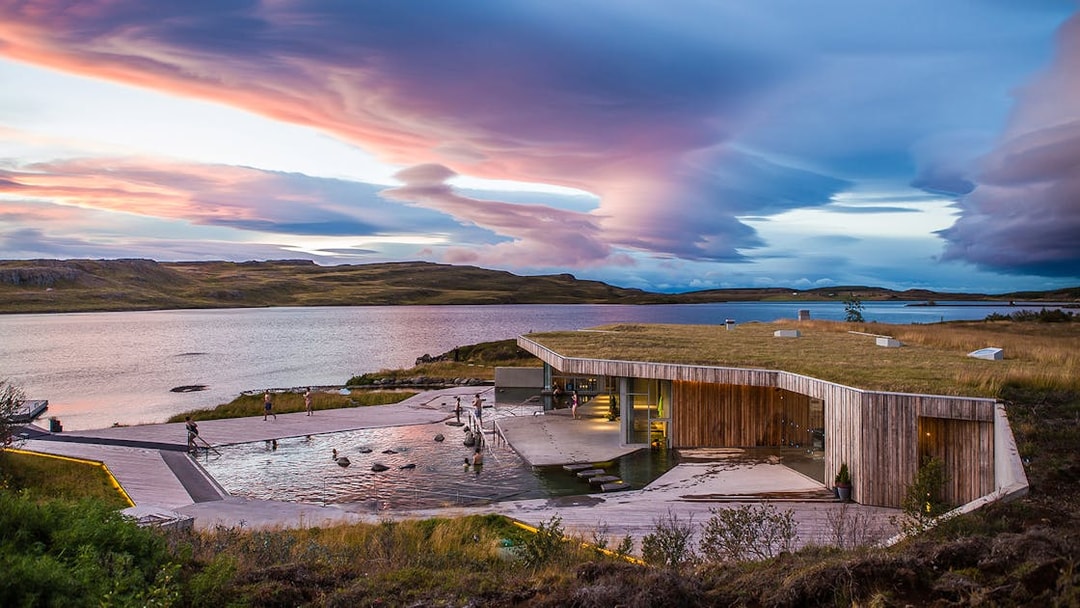 Vök Baths geothermal pools overlooking a serene lake near Reykjavik, Iceland.