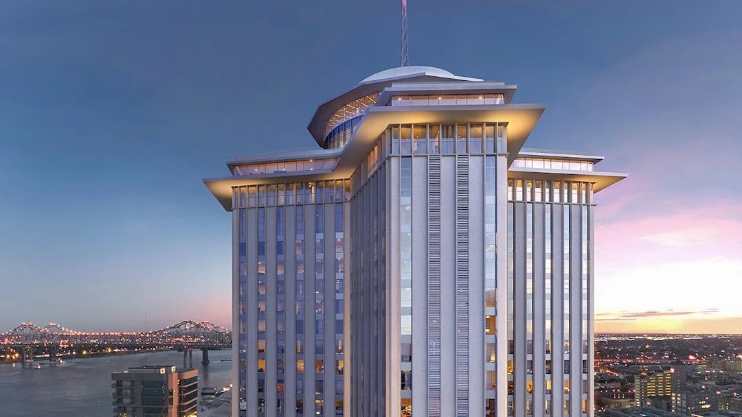 Vue Orleans Observation Deck with city skyline and river view at sunset.