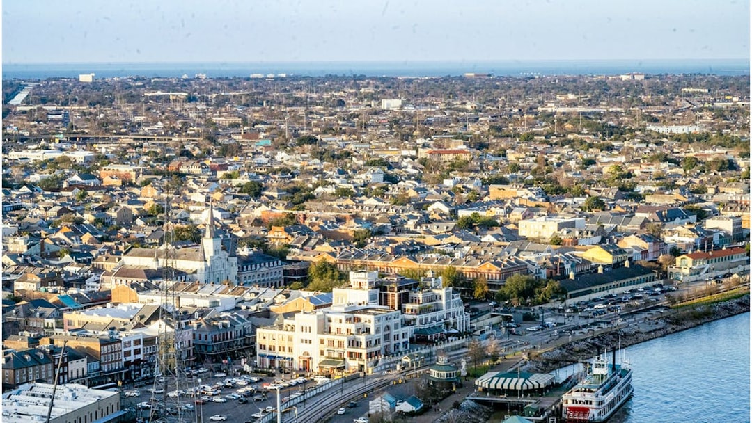 Aerial view of New Orleans from Vue Orleans Observation Deck, featuring the Mississippi River and cityscape.