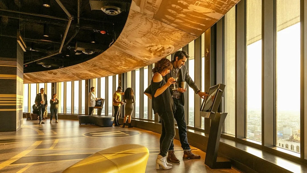 People using viewfinder at Vue Orleans Observation Deck, New Orleans.