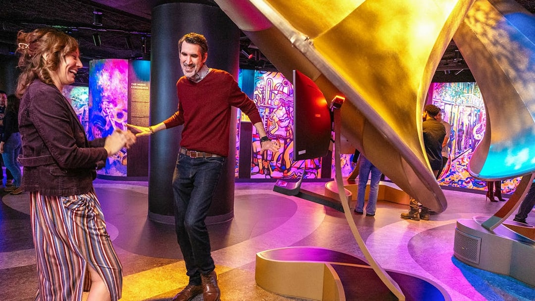 People enjoying music and dancing inside Vue Orleans Observation Deck.