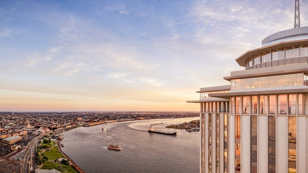 Aerial view of the Vue Orleans Observation Deck overlooking the Mississippi River at sunset.