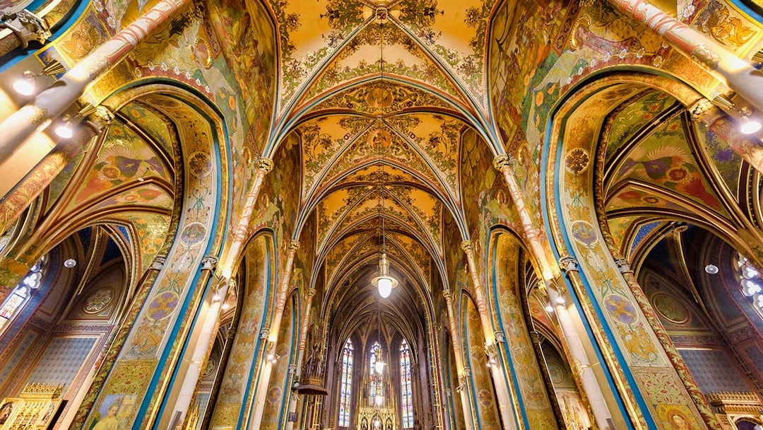 Vyšehrad Castle interior with ornate arches and detailed frescoes, Prague.