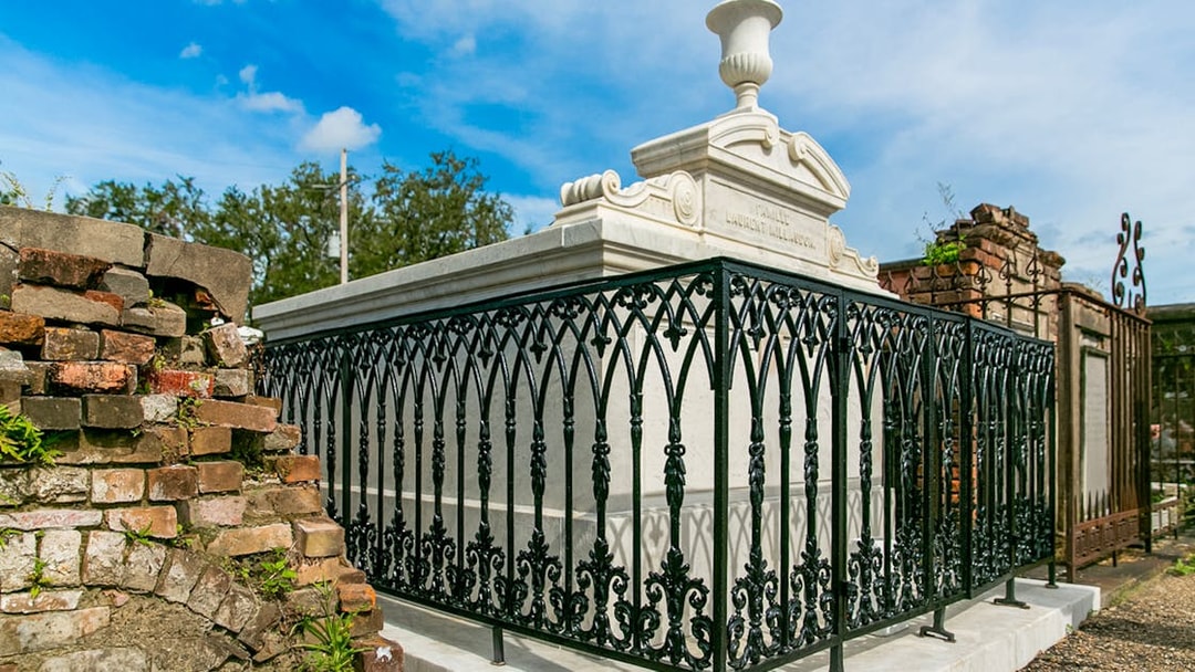 Tomb with ornate iron fence in St. Louis Cemetery, New Orleans.