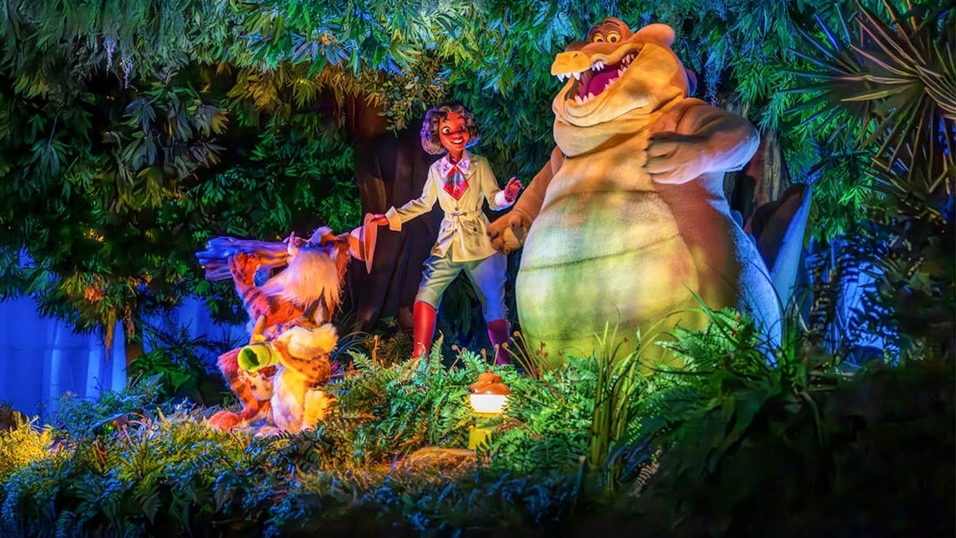 Tiana and friends in a vibrant bayou scene at night, Walt Disney World Resort, Orlando.