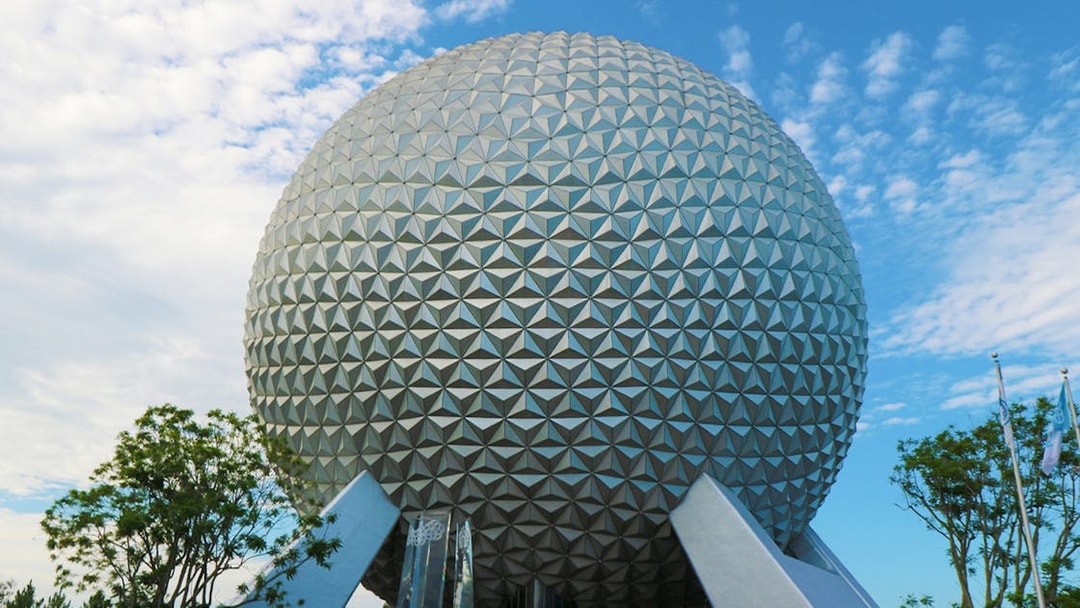 Spaceship Earth at EPCOT, Walt Disney World, Orlando, under a blue sky.