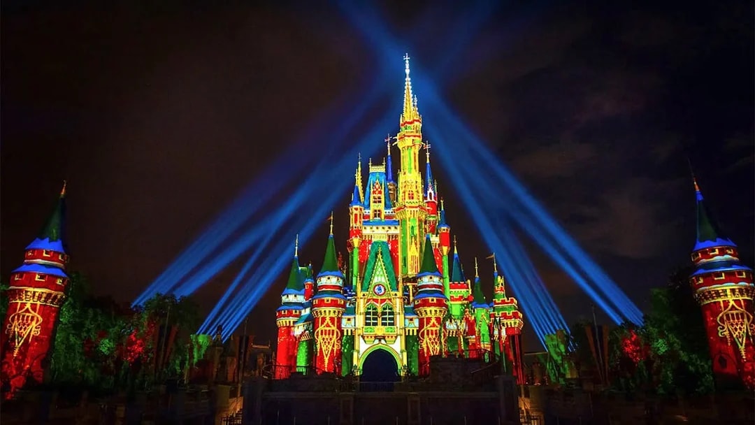 Disney Castle illuminated with lasers during Mickey's Not-So-Scary Halloween Party, Orlando.