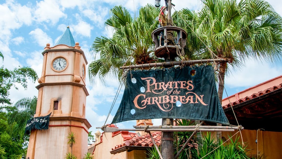 Pirates of the Caribbean entrance sign with clock tower at Walt Disney World Resort, Orlando.