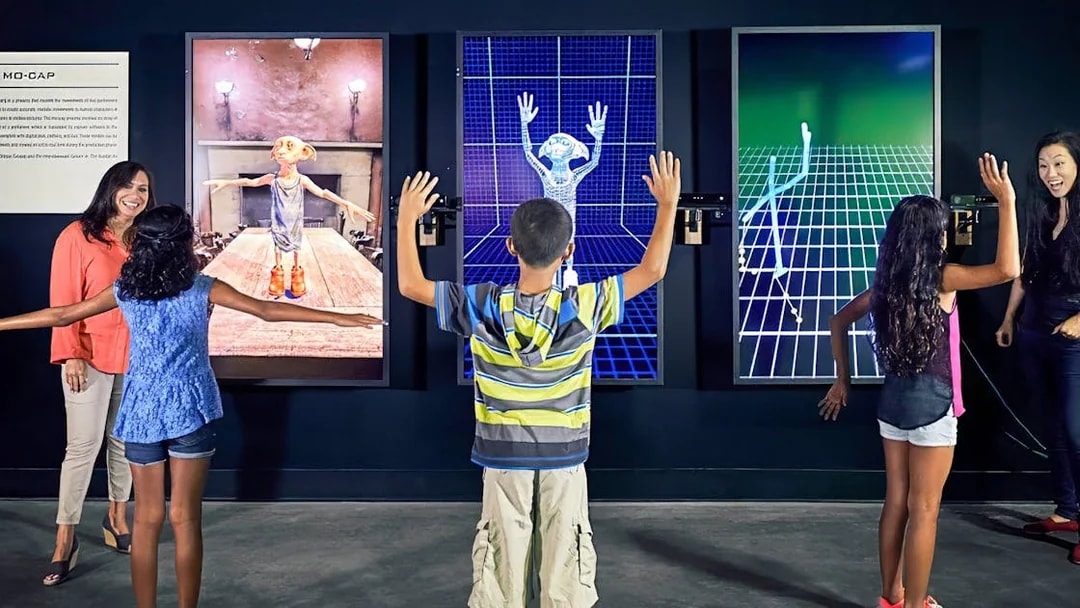 Visitors engaging with motion capture exhibits at Warner Bros Studio Tour Hollywood.