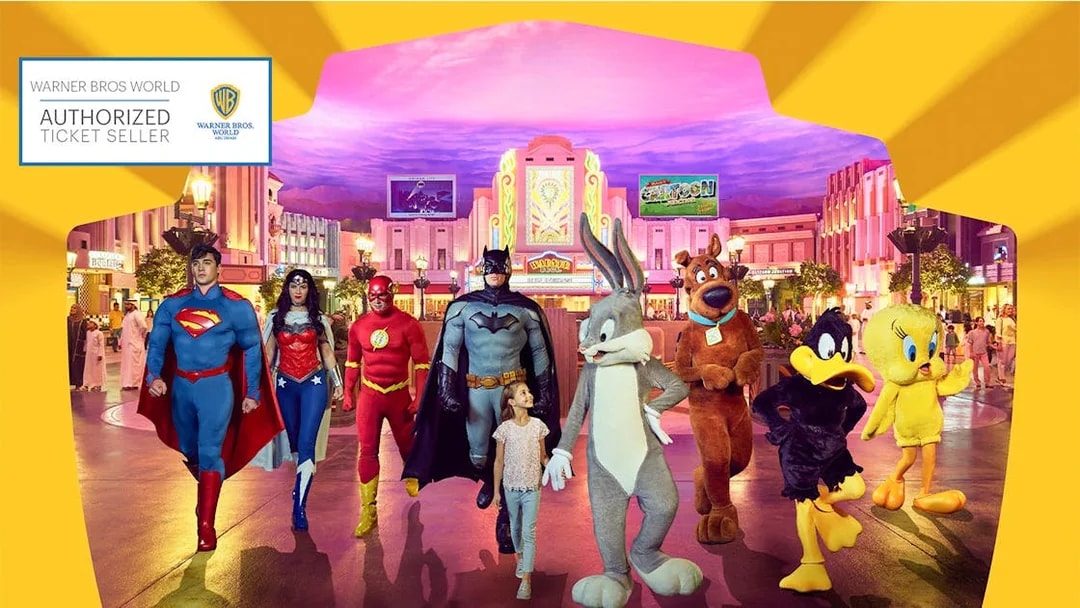 Warner Bros. World Abu Dhabi characters with child in theme park setting.