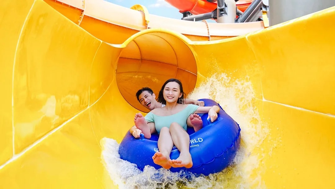 Couple on a water slide at Ocean Park Hong Kong.