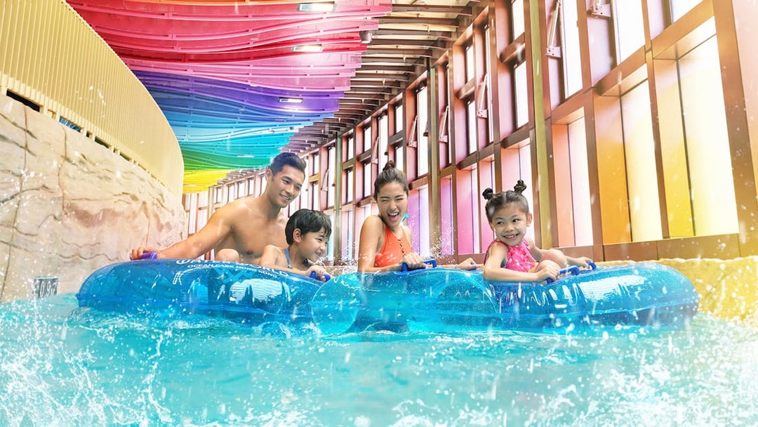 Family enjoying a water ride at Water World Ocean Park Hong Kong.