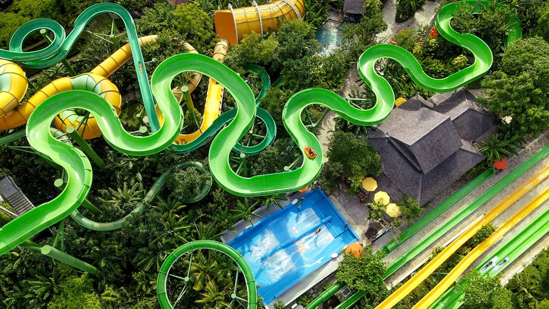 Aerial view of winding waterslides and wave pool at Waterbom Bali.