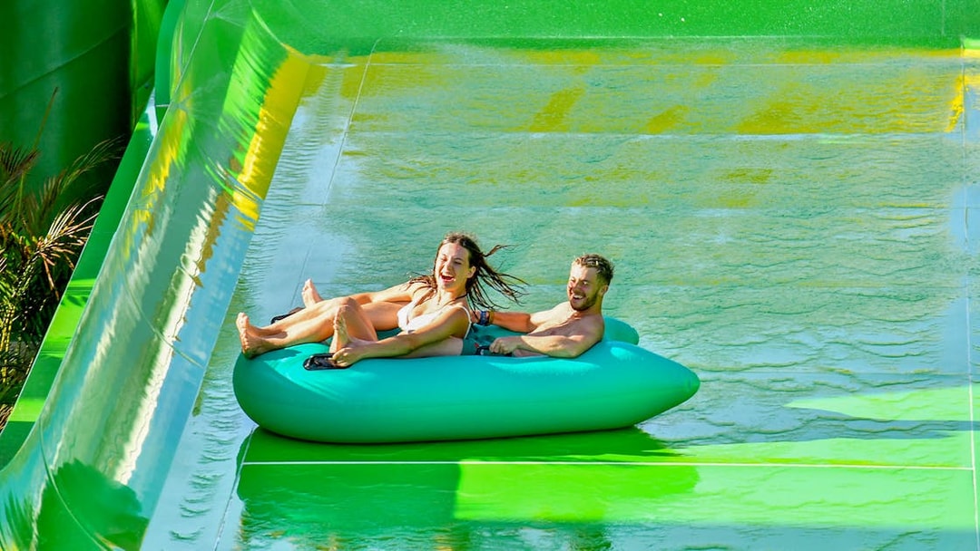Couple on a tube sliding down at Waterbom Bali.