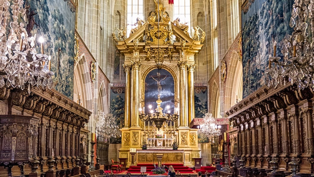 Wawel Cathedral interior with ornate altar and chandeliers, Krakow guided tour.