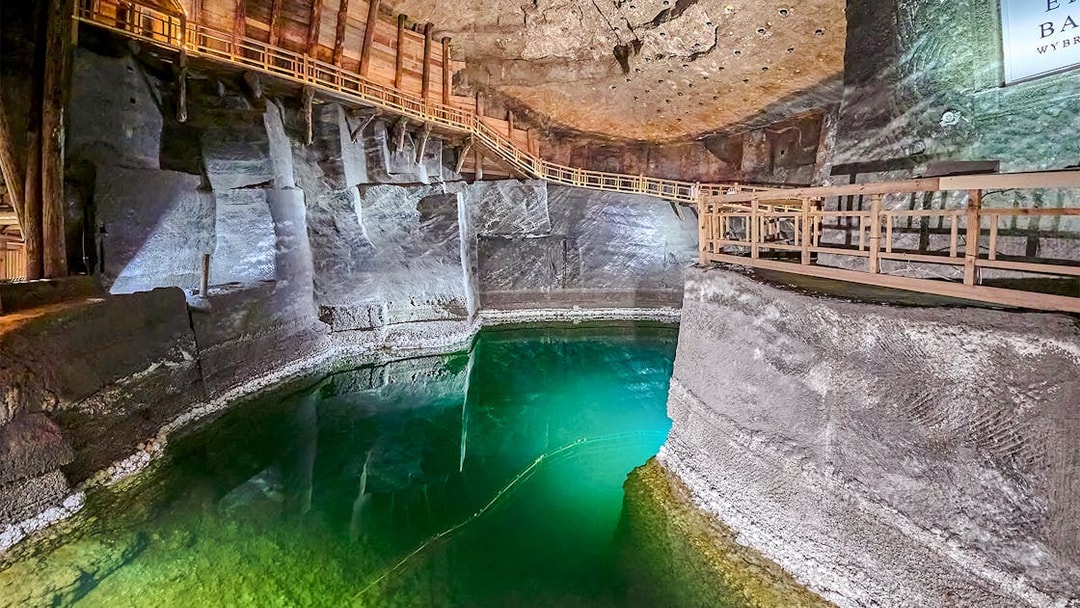 Underground lake with wooden walkways in Wieliczka Salt Mine, Poland.
