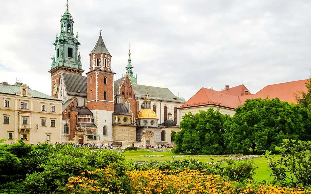 Wawel Castle and Cathedral in Krakow with gardens in the foreground.