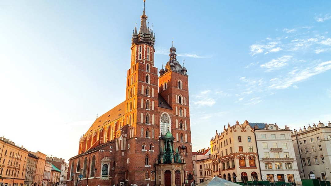 St. Mary’s Basilica in Krakow's Old Town during sunset.