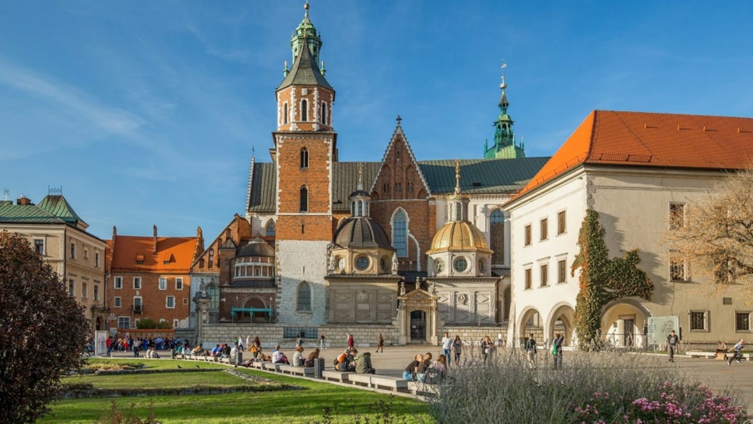 Wawel Cathedral exterior with tourists in Krakow, Poland.