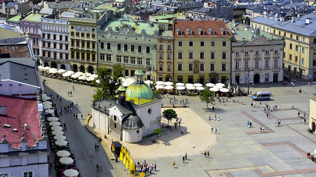 Aerial view of Kraków's Main Square with St. Adalbert's Church and surrounding historic buildings.