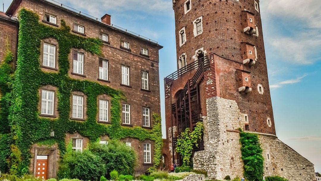 Wawel Castle tower and ivy-covered building on Wawel Hill, Krakow.