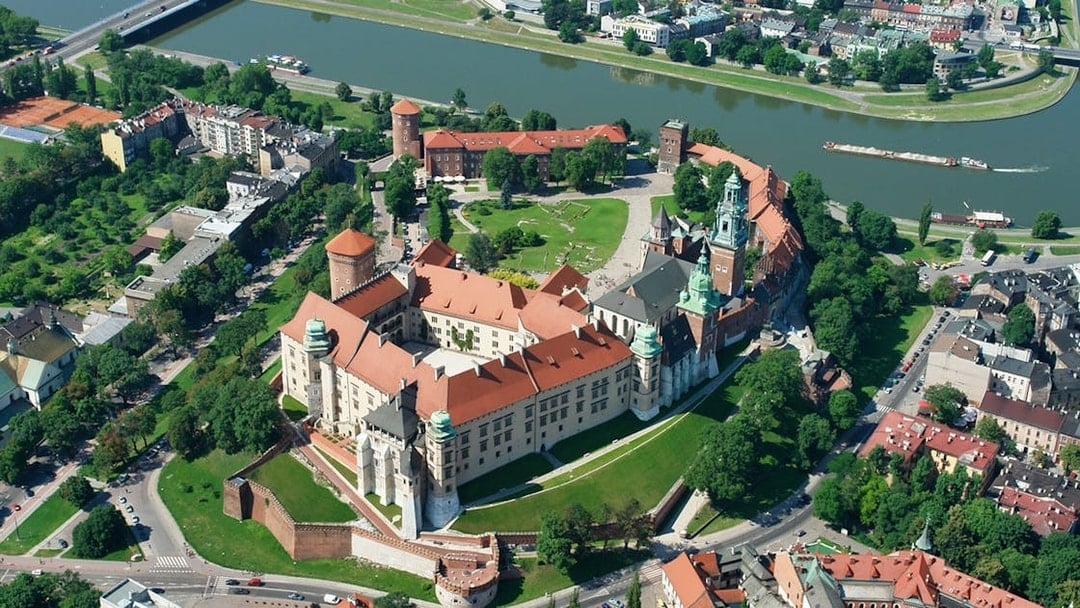 Aerial view of Wawel Royal Castle on Wawel Hill, Kraków, Poland, surrounded by the Vistula River.